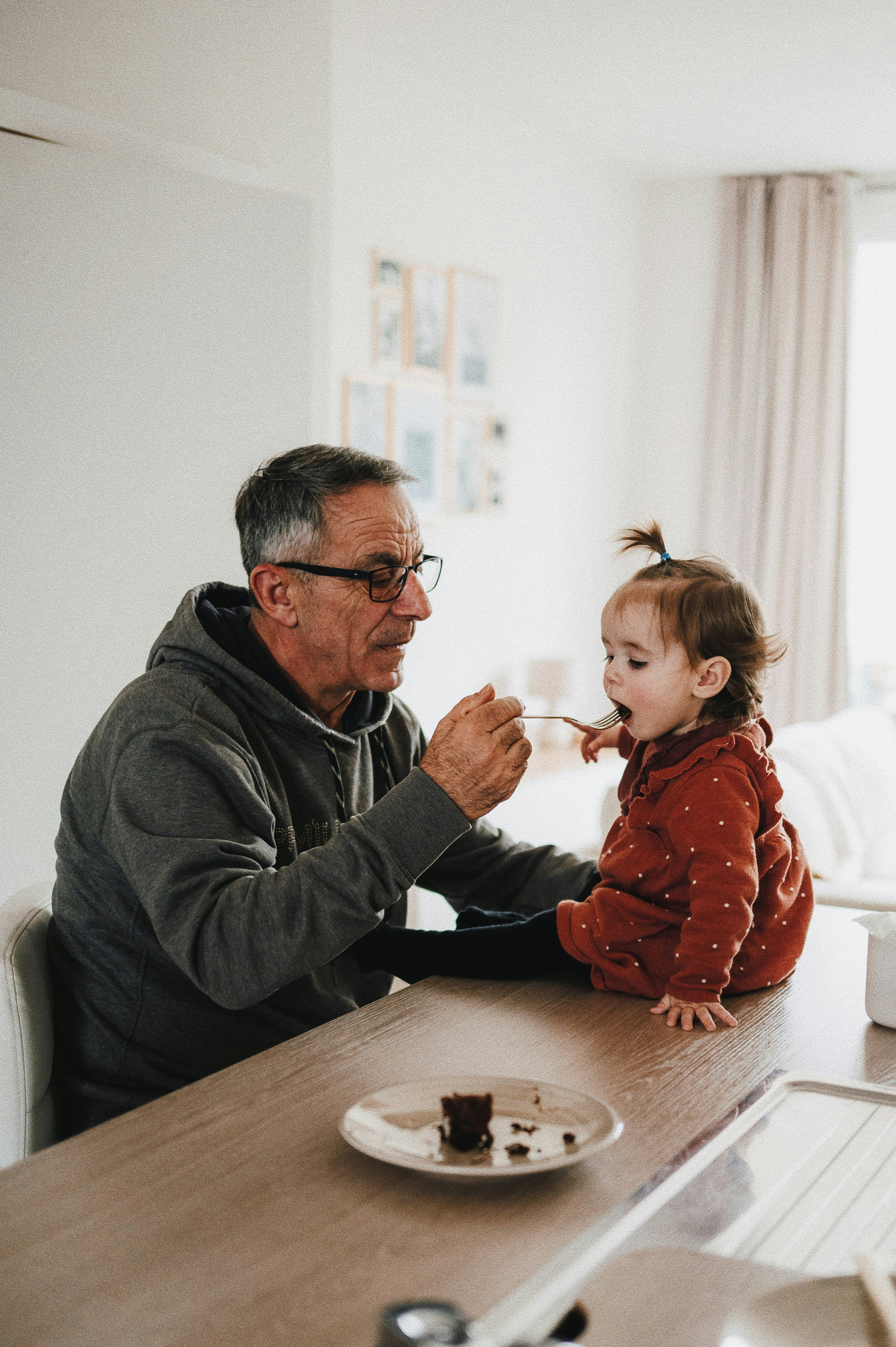 Grandparent with child feeding