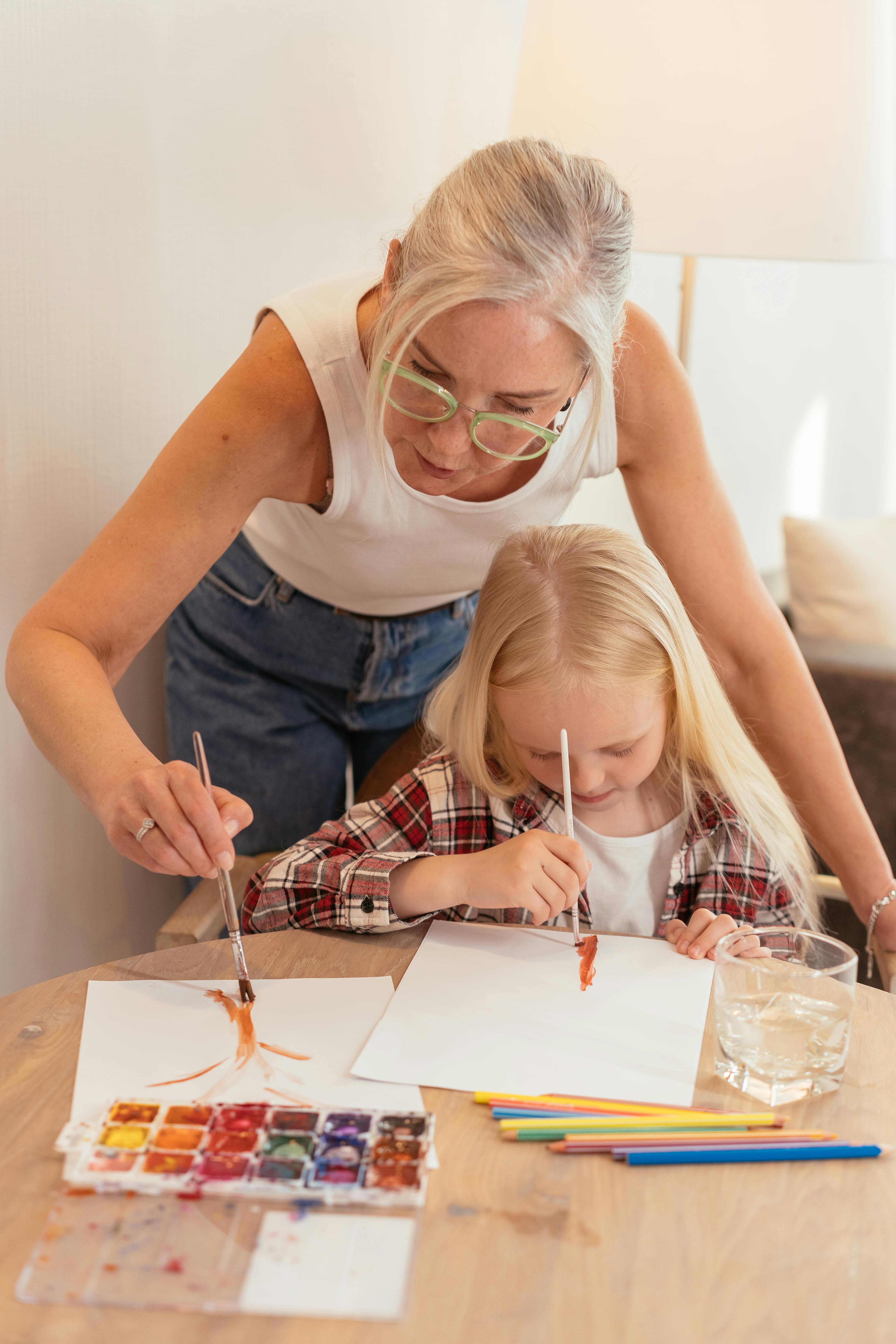 grandmother and child painting