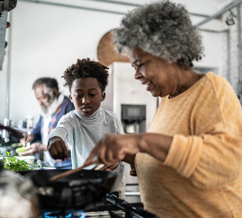 grandparent and child cooking