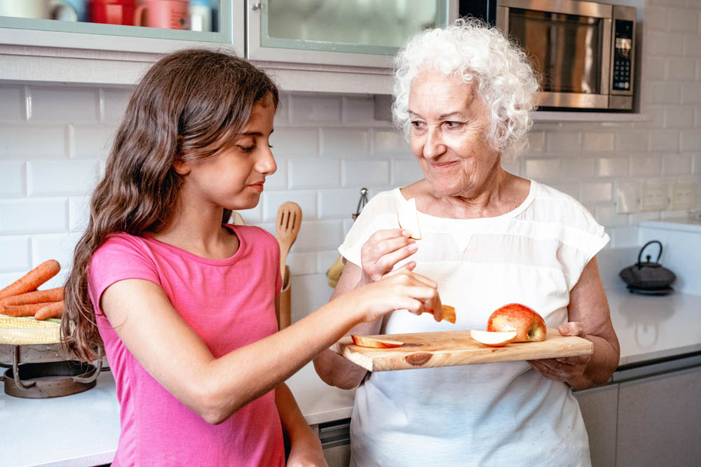 grandmother and teen eating