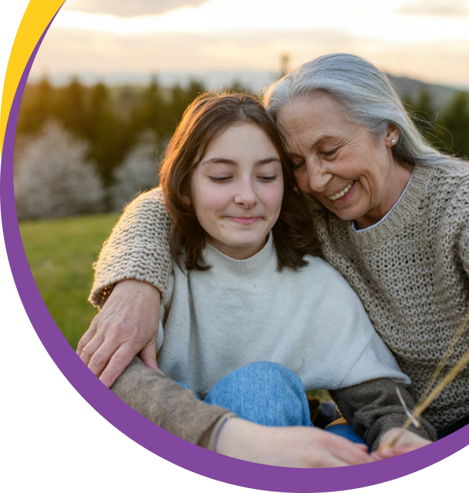 grandmother with arm around teen