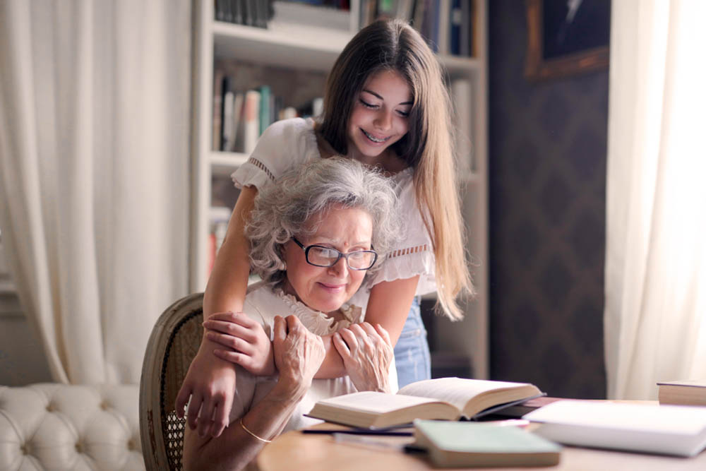 teen hugging grandmother